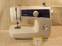 Front view of Brother LS-2129 sewing machine showing stitch selection dial and stitch function panel.