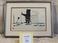 Full view of framed Inuit art print showing an Inuit woman fishing, igloo, fish, and ice fishing tools.