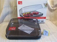 Vacu Vin Cool Plate package in background with the serving tray and cover in front, showing box branding and product assembled.