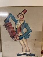 Clown portrait print showing accordion player clown signed 1972 by Red Skelton, framed in plexiglass box frame