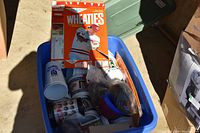Plastic tub containing baseball-themed cups, plastic hats, and Wheaties cereal boxes with baseball player images.