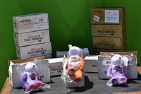 Overview of multiple American's Value Showcase boxes with three bears displayed front and center, each bear sealed in plastic bags.