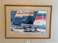 Framed print depicting colorful sailboats with striped sails on water, by Steven Jordan.