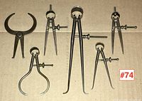 Six antique machinists callipers grouped together showing size and variety.