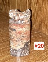 Full front view of chop seal showing whole piece with carved foo dog on top and marbled stone body.