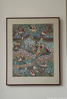 Frontal view of colorful folk art village scene framed print on wall