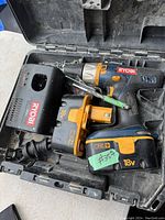 Ryobi cordless drill with two 18V batteries and charger in carrying case