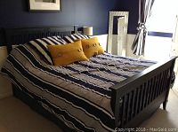 Full assembled bed with mattress, box spring and bed skirt; bedding not included