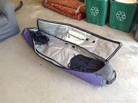 Open travel ski bag showing interior lining and mesh pockets