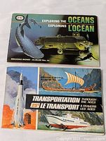 Two Brooke Bond Tea Card albums from the 1960s with illustrated covers. One titled 'Exploring the Oceans' (Album No.14) showing ocean life and submersible, the other 'Transportation Through the Ages' (Album No.10) showing various historic and modern transport vehicles.
