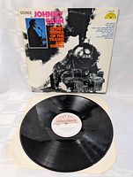 Vinyl LP record on white background with Sun Records label showing.