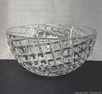 Clear view of the crystal bowl showing the grid pattern and rounded shape.