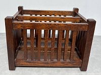 Front and side angle view showing the wooden vertical slats and dark stained wood grain.