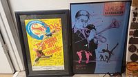 Framed signed Broadway Swing musical poster and Columbus Jazz Festival illustration poster side by side on floor.