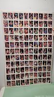 Full uncut sheet of NBA Hoops basketball cards showing all cards in a grid layout featuring various NBA players in game action.