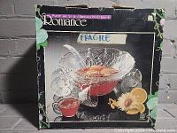 Original box for Romance brand punch bowl set showing bowl filled with punch and ladle, eight cups, and floral grapefruit decoration on box
