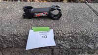 Photo of Easton EA90 bike stem lying on concrete surface, showing branding and stem clamps.
