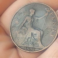 Reverse side of 1897 Queen Victoria large penny showing seated Britannia with trident and shield, dated 1897.