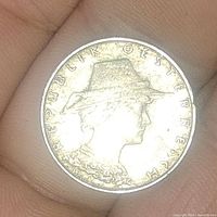 Obverse of the coin showing a profile bust of a figure wearing a hat with the text 'REPUBLIK OESTERREICH'.