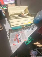 Open three-tray tackle box, clear organizer, rod holder and packaged tackle