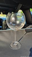 Single clear red wine glass showing size and style