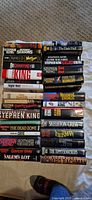 Three stacks of Stephen King hardcovers showing spines and titles