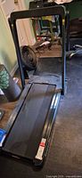 Full view of SuperFit folding treadmill upright