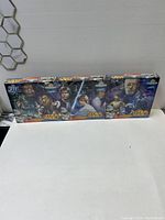 Three boxed Star Wars puzzles lined up horizontally on a white surface, showing front cover artwork and puzzle piece counts.