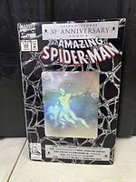 Full front cover of The Amazing Spider-Man #365 30th Anniversary comic showing the black webbed design and holographic Spider-Man image.