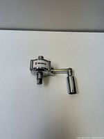 Würth Auto Buddy Loosen-er hand tool placed on a white surface showing full front and handle side views.