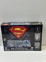 Box front showing Superman logo, puzzle image and 3D building models included