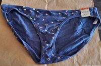 Front view of navy blue bikini bottom with visible price tag attached. Peace sign and flower pattern all over fabric.