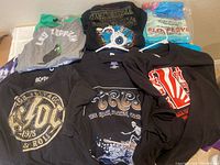 T-shirts including black AC/DC, Led Zeppelin grey, and various TRPS branded shirts with graphic prints.