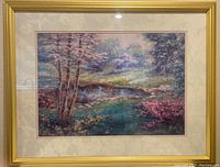 Framed watercolor print showing the full artwork and frame with marbled double matting and gold-colored frame.