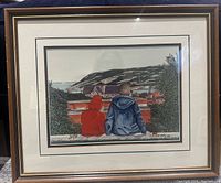 Framed print showing two children overlooking a coastal landscape with buildings and trees.
