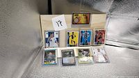 Overall view showing all cards in two rows, each in plastic sleeve