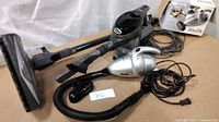Overview of both Shark vacuums with accessories