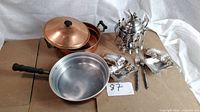 Overall lot showing copper cookware, silver-plated sugar bowl with spoons, forks and candy dishes