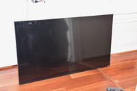 Photo of 56 inch Vizio TV screen showing the front, capturing size and condition.
