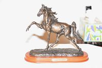 Full view of Tennessee walking horse bronze finish sculpture on brown base