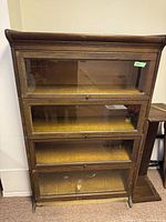 Front view showing full unit with four sections and glass doors