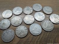 All 13 Canadian silver dimes showing the reverse with Bluenose schooner design, dates visible on some coins.