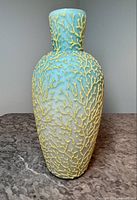 Full front view of vase showing satin finish and seaweed pattern