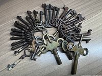 Overall view of the skeleton keys on rings and brass carriage clock keys