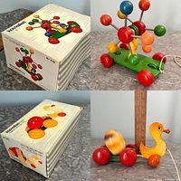 Original box for multi-colored atomic structure pull toy by Kouvalias No 641 and the toy on grey surface
