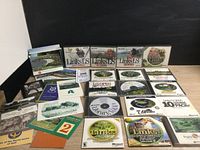 Overview of all Links LS golf games from 1998 through 2001, plus multiple expansion discs, score cards, and manuals arranged on a flat surface.