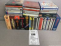 Photo of the full lot of stacked CD boxes and jewel cases featuring classical and opera titles.