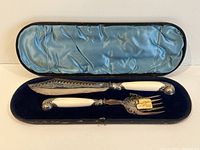 Fish servers in their original box with blue velvet and satin interior lining.