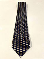 Full view of Hermes blue silk tie with horse race print.