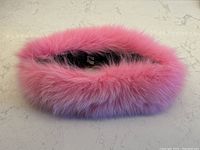 Top view showing the fluffy, bright pink fox fur plush fur ring shape.